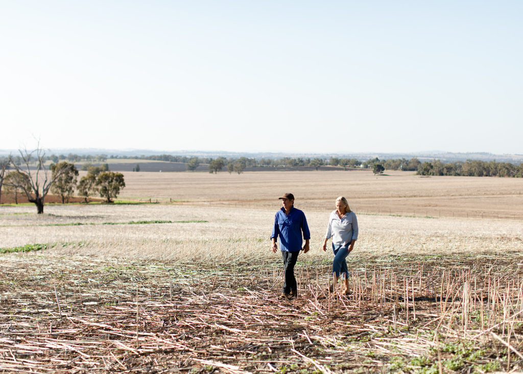 Gary and Heather walking through paddock